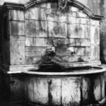 Amatrice, fountain in Via di Santa Maria della Porta, photograph from the Soprintendenza ai Monumenti del Lazio taken for the cataloguing campaign in 1977. Photo: Archivio della Soprintendenza ai Monumenti del Lazio, SBAS RM 54594